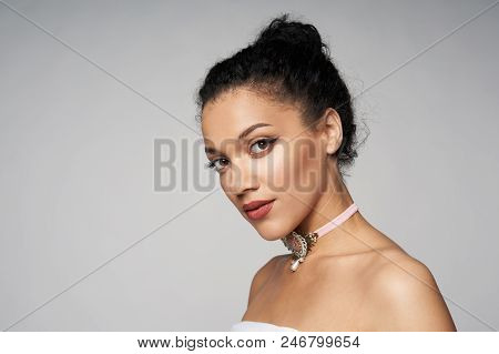 Beauty Closeup Portrait Of Beautiful Mixed Race Woman Wearing Chocker Looking At Camera, Isolated On