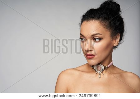 Beauty Closeup Portrait Of Beautiful Mixed Race Woman Wearing Chocker Looking To Side, Isolated On G