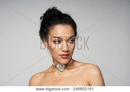 Beauty Closeup Portrait Of Beautiful Mixed Race Woman Wearing Chocker Looking To Side, Isolated On G
