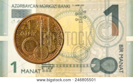 1 Azerbaijani Qepik Coin Against 1 Azerbaijani Manat Bank Note
