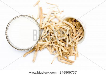 Close Up Of Ayurvedic Herb  Satavari Or Kurilo Or Asparagus Racemosus Isolated On White In A Glass B