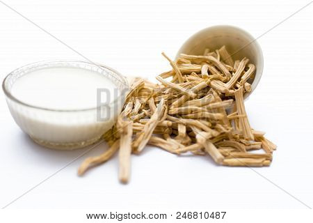 Close Up Of Ayurvedic Herb  Satavari Or Kurilo Or Asparagus Racemosus Isolated On White In A Glass B