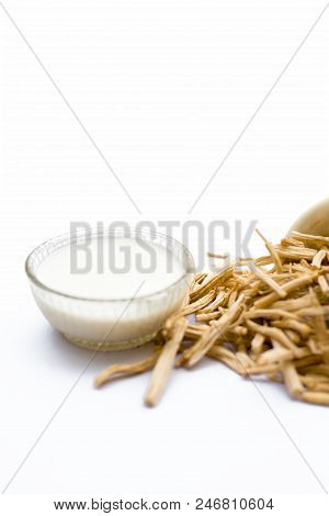 Close Up Of Ayurvedic Herb  Satavari Or Kurilo Or Asparagus Racemosus Isolated On White In A Glass B
