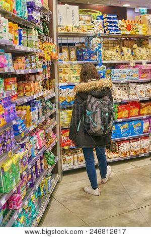MILAN, ITALY - CIRCA NOVEMBER, 2017: customer at Carrefour Express store in Milan.