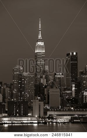 NEW YORK CITY - JUL 4: Empire State Building with skyscrapers on July 4, 2015 in Manhattan, New York City. With population of 8.4M, it is the most populous city in the United States.