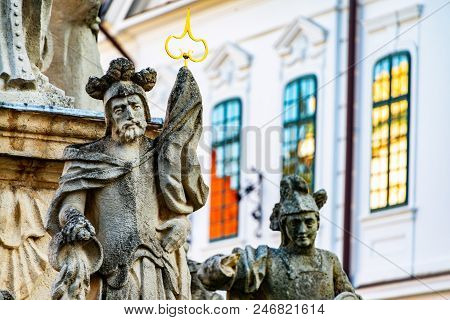 Veszprem, Hungary. Fountain Decoration Statues In Veszprem, Hungary. Historical Buildings At The Bac