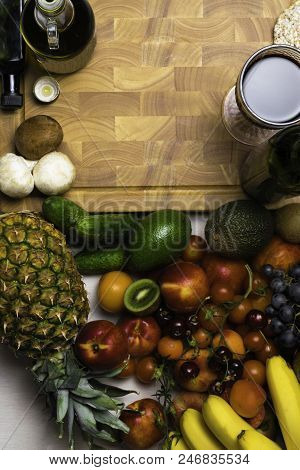 Mediterranean Food Background. Assortment Of Fresh Fruits And Vegetables, Tomatoes, Pineapple, Banan