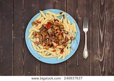Vegetarian Healthy Food. Forest Mushrooms Golden Chanterelles And Pasta Penne With Chili Pepper In B