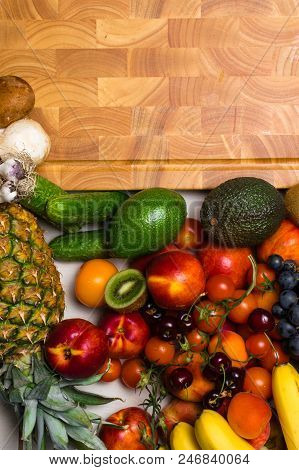 Mediterranean Food Background. Assortment Of Fresh Fruits And Vegetables, Tomatoes, Pineapple, Banan