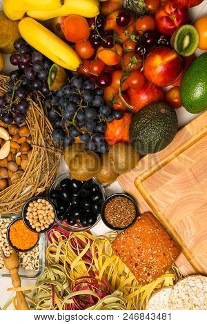Mediterranean Food Background. Assortment Of Fresh Fruits And Vegetables, Tomatoes, Pineapple, Banan