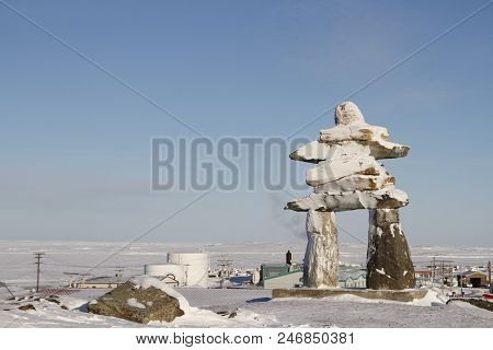 Inukshuk Or Inuksuk Landmark Covered In Snow Found On A Hill In The Community Of Rankin Inlet, Nunav