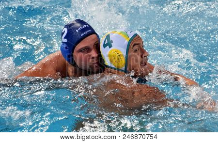 Budapest, Hungary - Jul 17, 2017. TOROK Bela, hungarian waterpolo player (in blue) fights with KAYES Joe (AUS). FINA Waterpolo World Championship was held in Alfred Hajos Swimming Centre.
