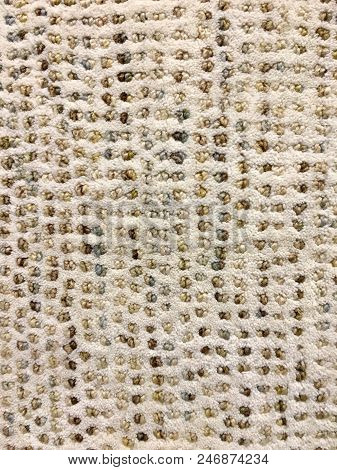 Rolled Carpet Samples On Display In A Carpet Shop With A Variety Of Brown To Beige Colour Options An