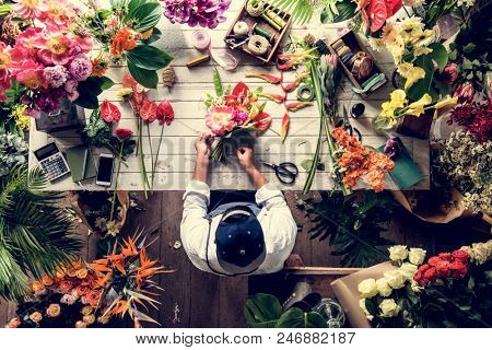 Florist making a flower arrangement in a flower shop