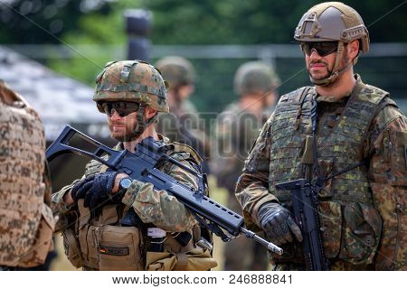 Feldkirchen / Germany - June 9, 2018: German Soldiers Stands Near Military Vehicles On A Open Day On