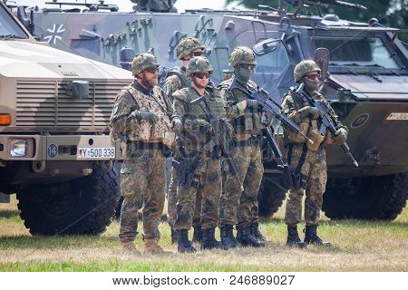 Feldkirchen / Germany - June 9, 2018: German Soldiers Stands Near Military Vehicles On A Open Day On