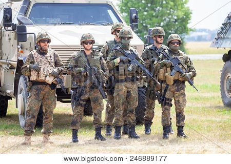 Feldkirchen / Germany - June 9, 2018: German Soldiers Stands Near Military Vehicles On A Open Day On