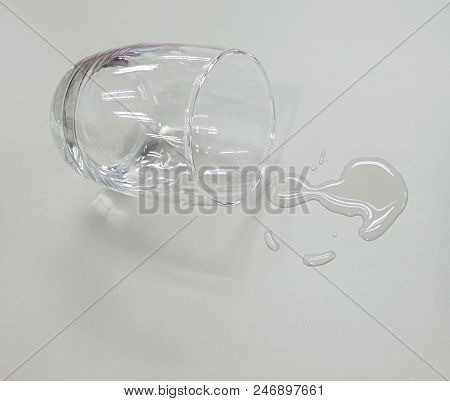 Water Glass Fall Down On The Table.
