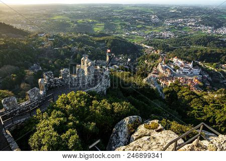 Long Shot Of Castle Of Moors Walls At Dusk With Sintra In The Background
