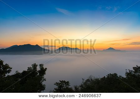 Mountains Under Mist In The Morning With Sunrise At Phutoke Loei Thailand.