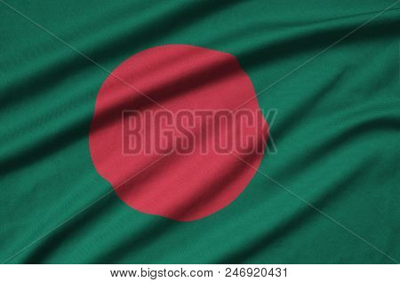 Bangladesh Flag  Is Depicted On A Sports Cloth Fabric With Many Folds. Sport Team Waving Banner