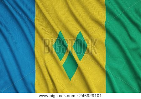 Saint Vincent And The Grenadines Flag  Is Depicted On A Sports Cloth Fabric With Many Folds. Sport T