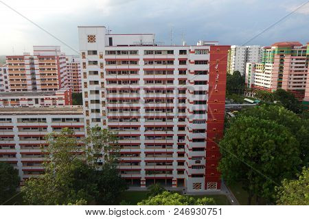 Singapore-25 Jun, 2018: Singapore Residential Housing Estate With Apartment Blocks Against A Cloudy 