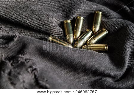 Full Metal Jacket 9Mm Ruger Bullet On Cloth Texture