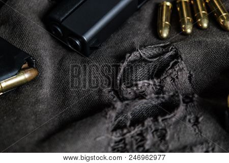 9Mm Semi Autometic Hand Gun With Fmj Bullet On Fabric