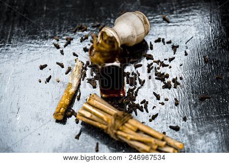 Popular Home Remedy For Toothache Or Tooth Related Problems I.e Clove Oil With Powder Of Black Peppe