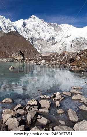 View Of Cho Oyu Mirroring In Lake - Cho Oyu Base Camp - Everest Trek - Nepal Himalayas Mountains