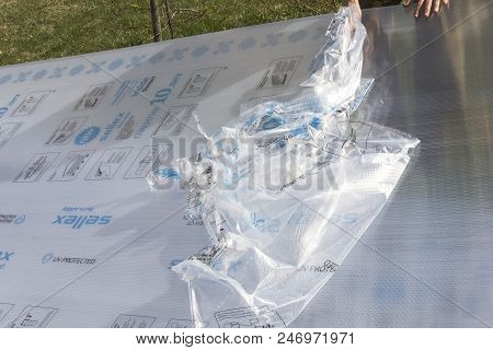Moscow/ Russia-22 May 2018;removing The Protective Film From Polycarbonate