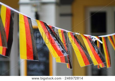 Gold Red Black Colored Paper Pennons On The Line. German Flag Banners Fluttering In Wind.  Pennant F