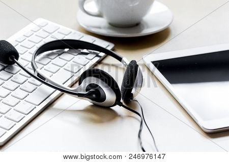 Profession Concept With Aup And Headset Of Call Center Manager On Beige Desk Background