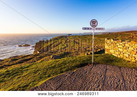 Signpost At Lands End Cornwall Uk, The Most Westerly Point Of England On The Penwith Peninsula. Suns