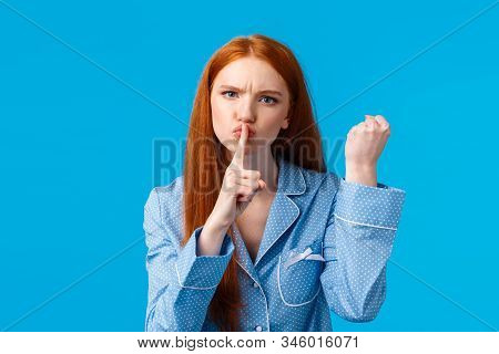 Shut Up Or Else. Angry And Displeased Redhead Girl Threaten Roommate Be Quiet And Shaking Fist, Warn