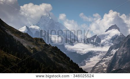 Snow Capped Mountain Peaks Of The Pointe De Zinal (3789m / 12431ft) And The Famous Matterhorn (4478m