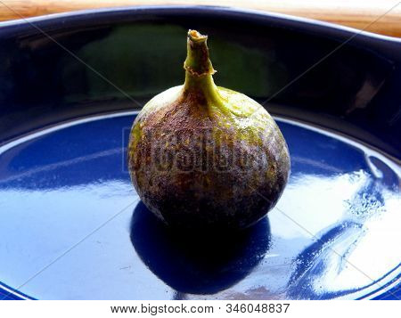 Figs Whole On A Blue Plate Close-up