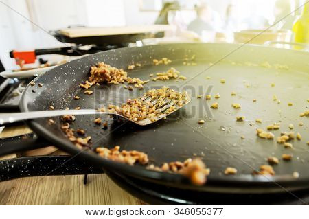 Empty Paella Pan With Traditional Spanish Food Usually Prepared With Rice, Meat, Seafood