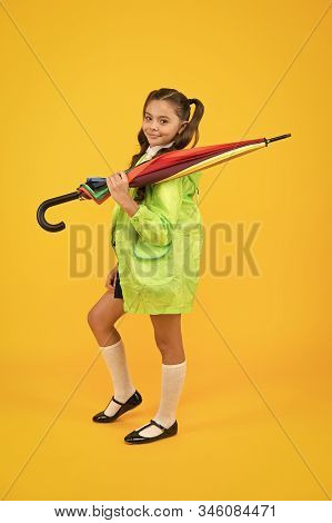 Rain Forecast On September 1. Cute Schoolgirl In Raincoat With Umbrella On September 1. Small Child 
