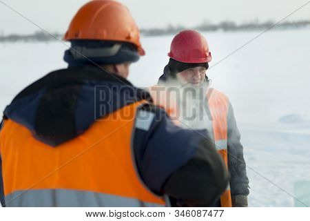 Slinger In An Orange Helmet At The Installation Site