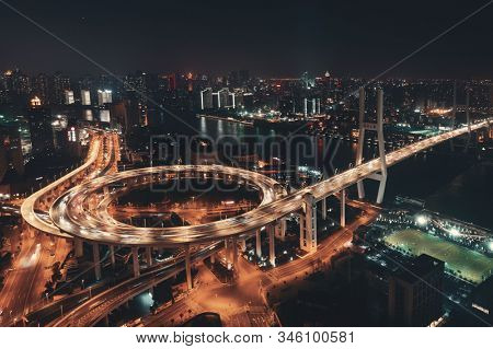 Shanghai Nanpu Bridge over Huangpu River with busy traffic in China.
