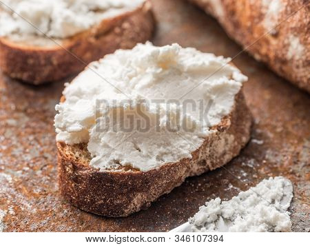 Whole Grain Bread Bruschetta With White Soft Curd Cream Cheese On A Ginger Grunge Background. Close-