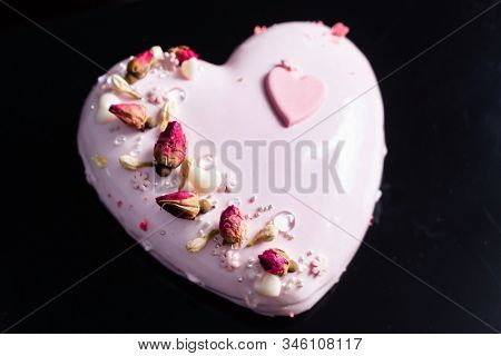 Cake with strawbery in the shape of heart on Valentine's Day