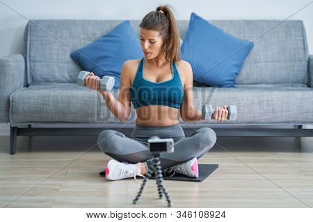 Fitness vlogger influencer recording live tutorial video