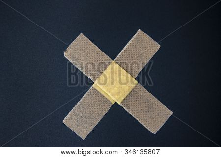 Adhesive Bandage Against A Black Background. Medical Adhesive Bandage Stock Image. Image Of Medical 