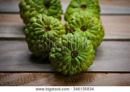 Fresh Custard Apple On Wooden Table Background