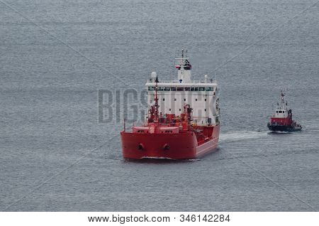 Oil Tanker - Red Ship And Fireboat On A Cruise At Sea