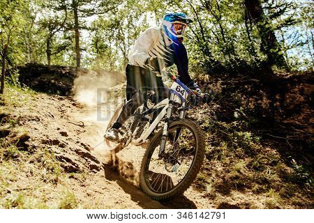 Downhill Xtreme Trail Rider Riding Race In Sunlight