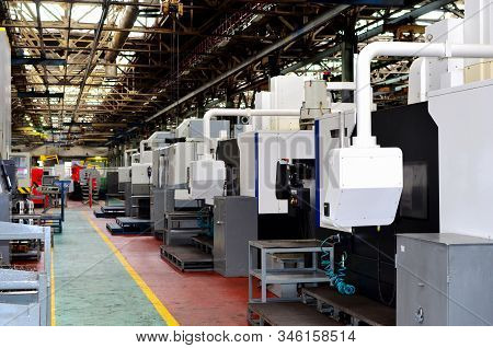 Workshop Of A Factory With Automatic Cnc Turning Machines. High Precision Computerized Cnc Plasma Cu